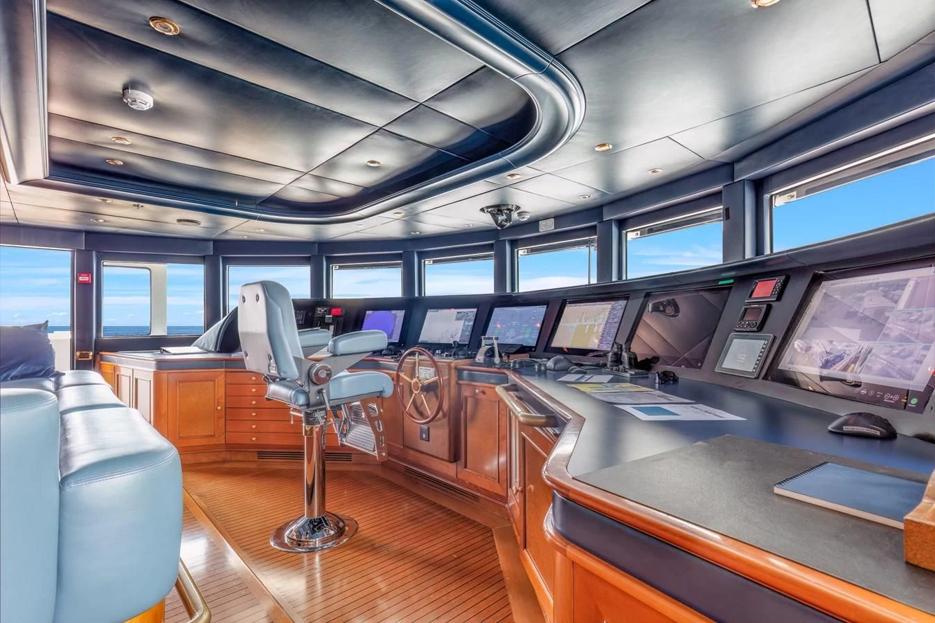 inside of a vehicle with a desk and chairs aboard NEXT CHAPTER Yacht for Sale