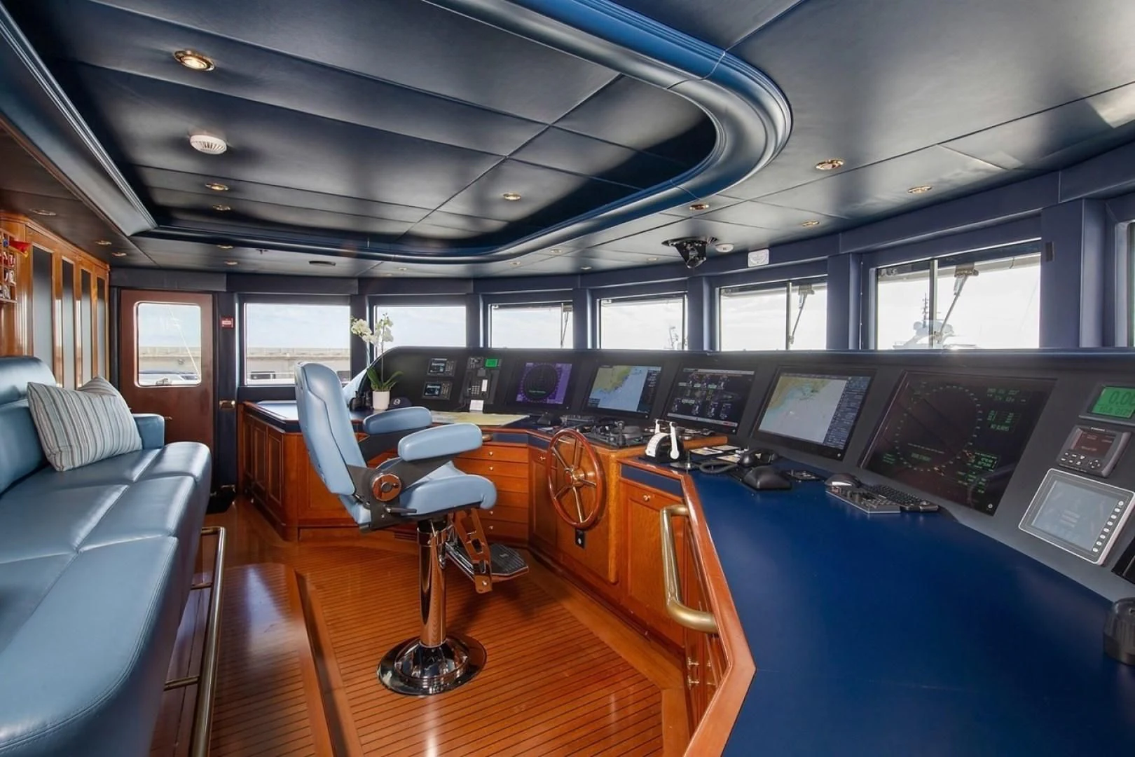 inside of a vehicle with a desk and chairs and a computer on the floor aboard NEXT CHAPTER Yacht for Sale