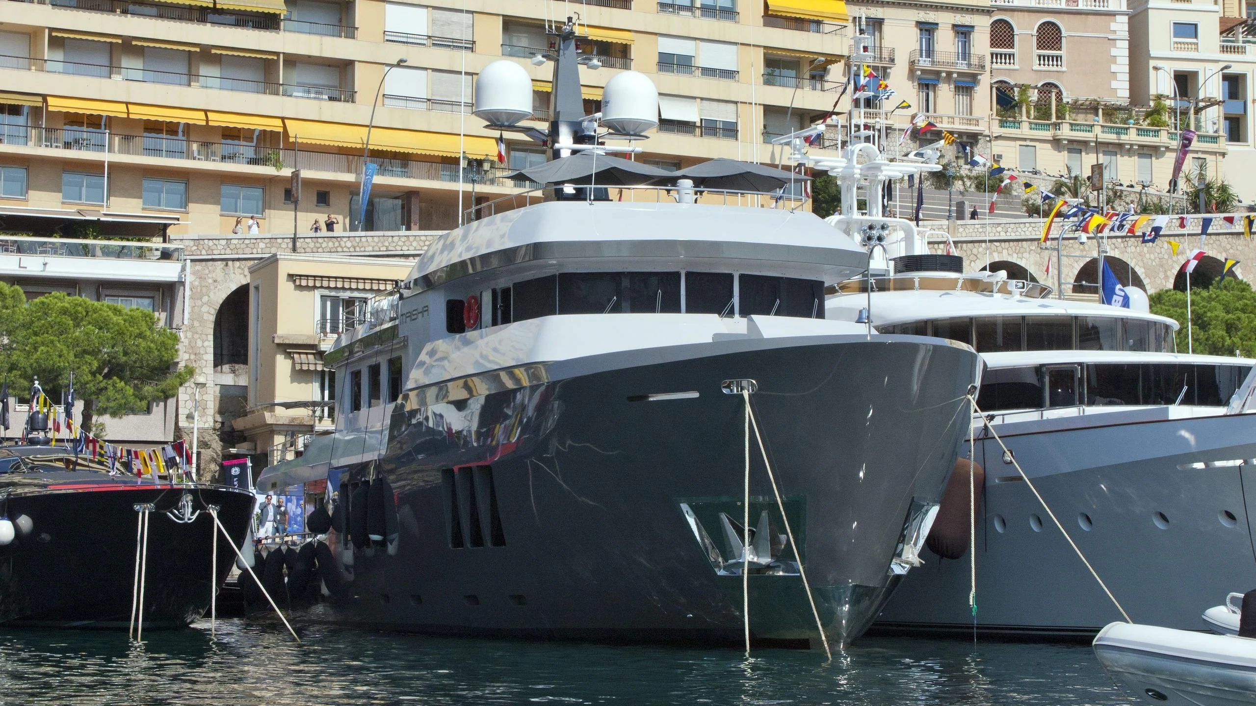 a group of boats are parked in a harbor aboard BONUM Yacht for Sale