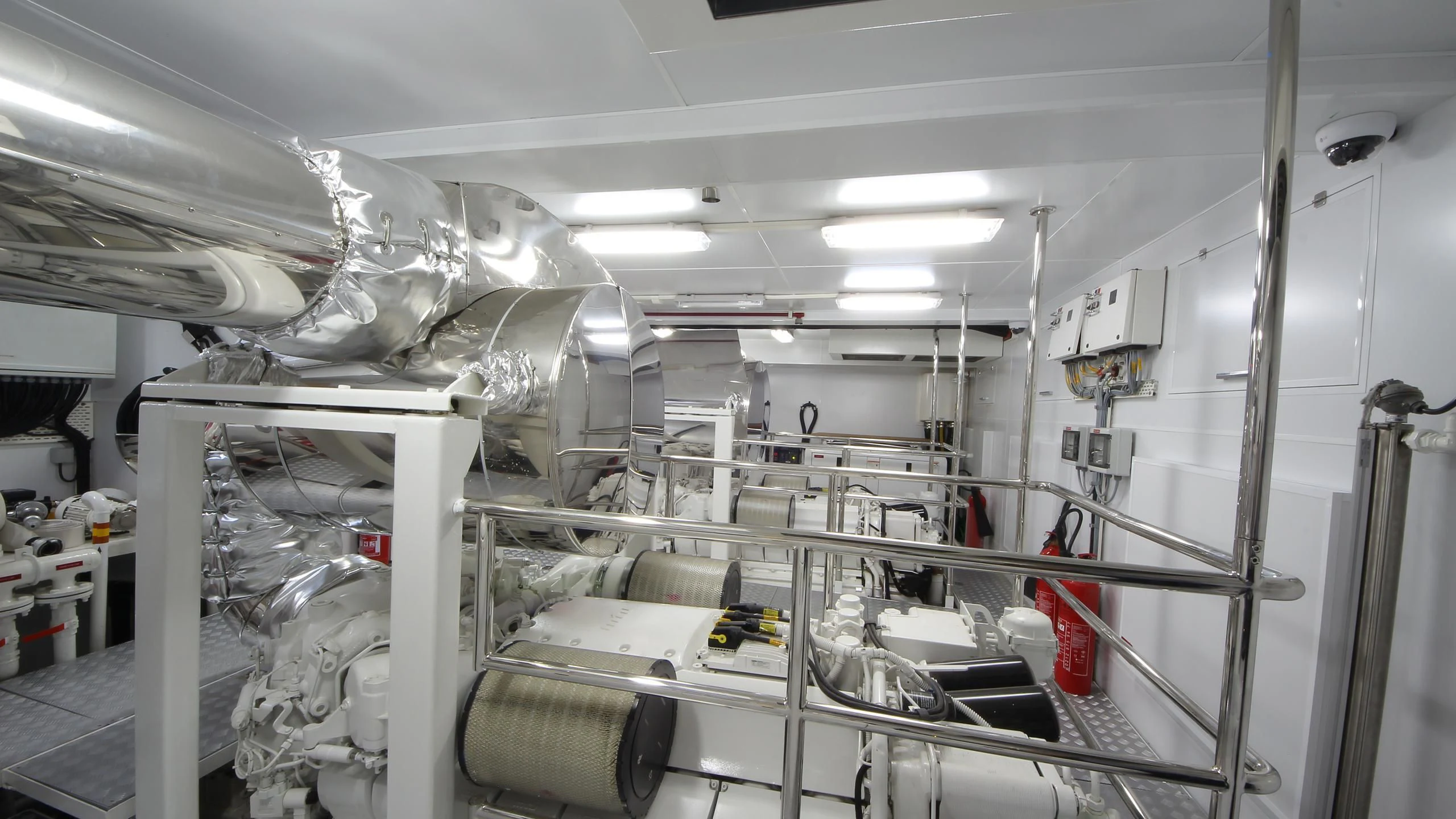 a room with white pipes aboard OCEAN CLUB Yacht for Sale