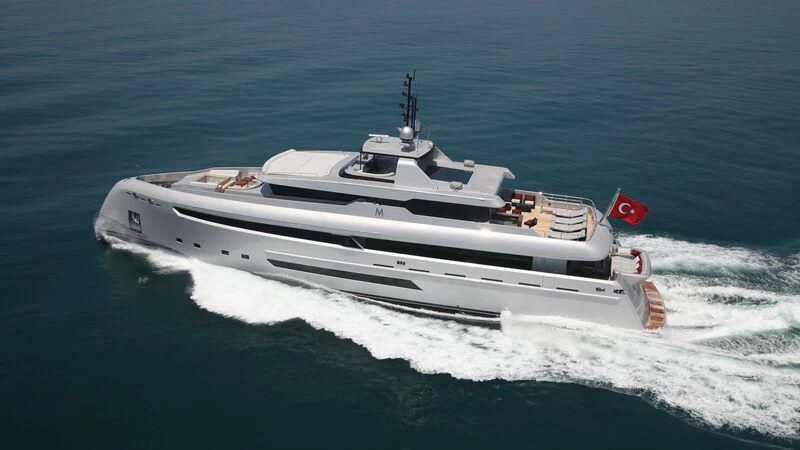 a white boat on the water aboard OCEAN CLUB Yacht for Sale