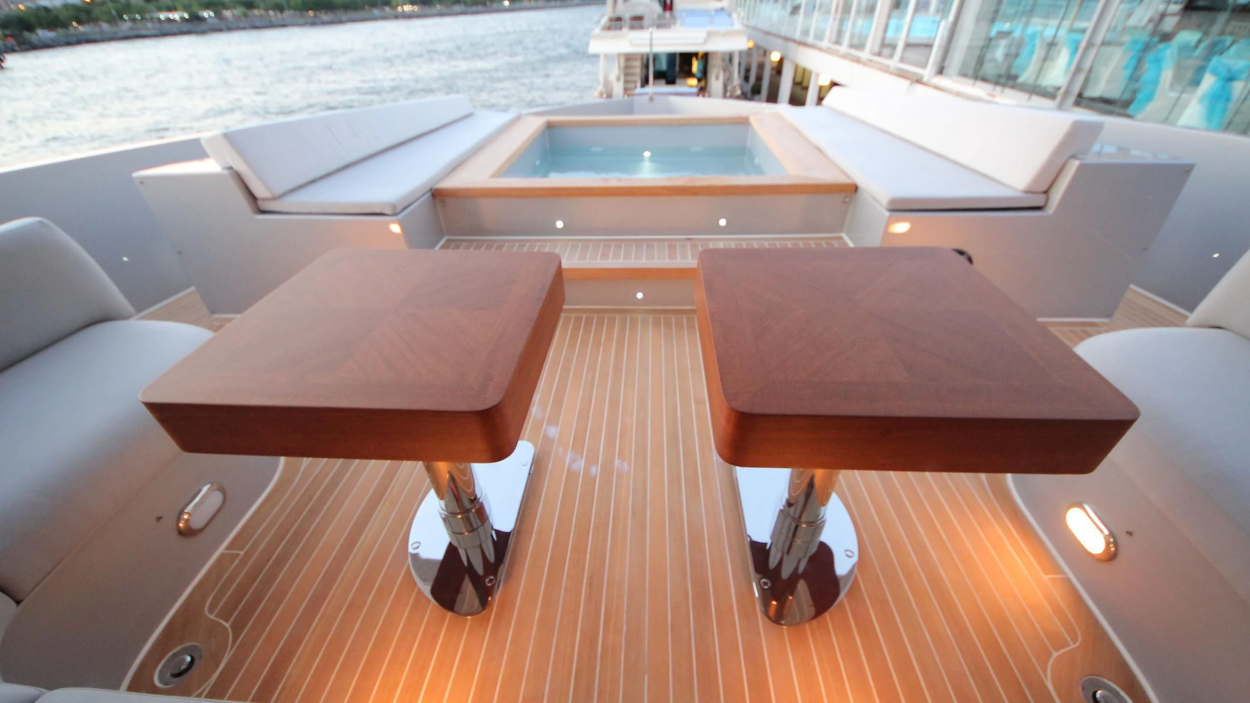 a deck with a pool aboard OCEAN CLUB Yacht for Sale