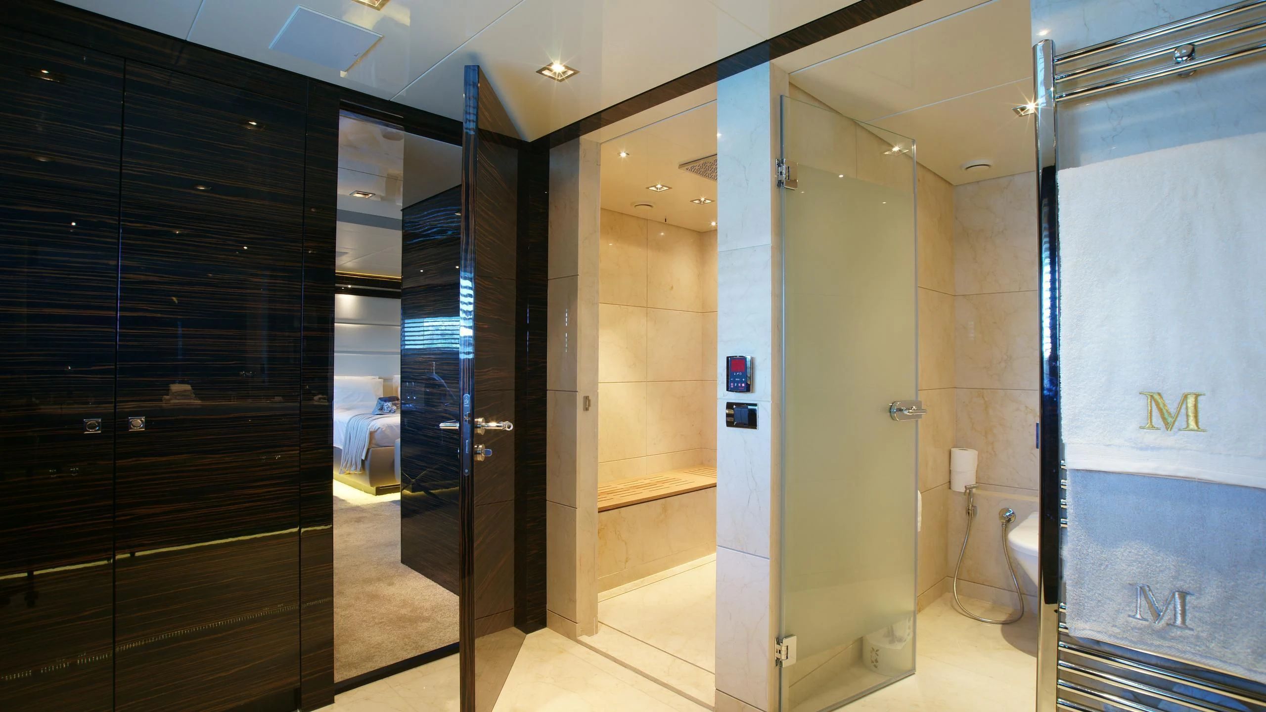 a bathroom with a glass shower aboard OCEAN CLUB Yacht for Sale