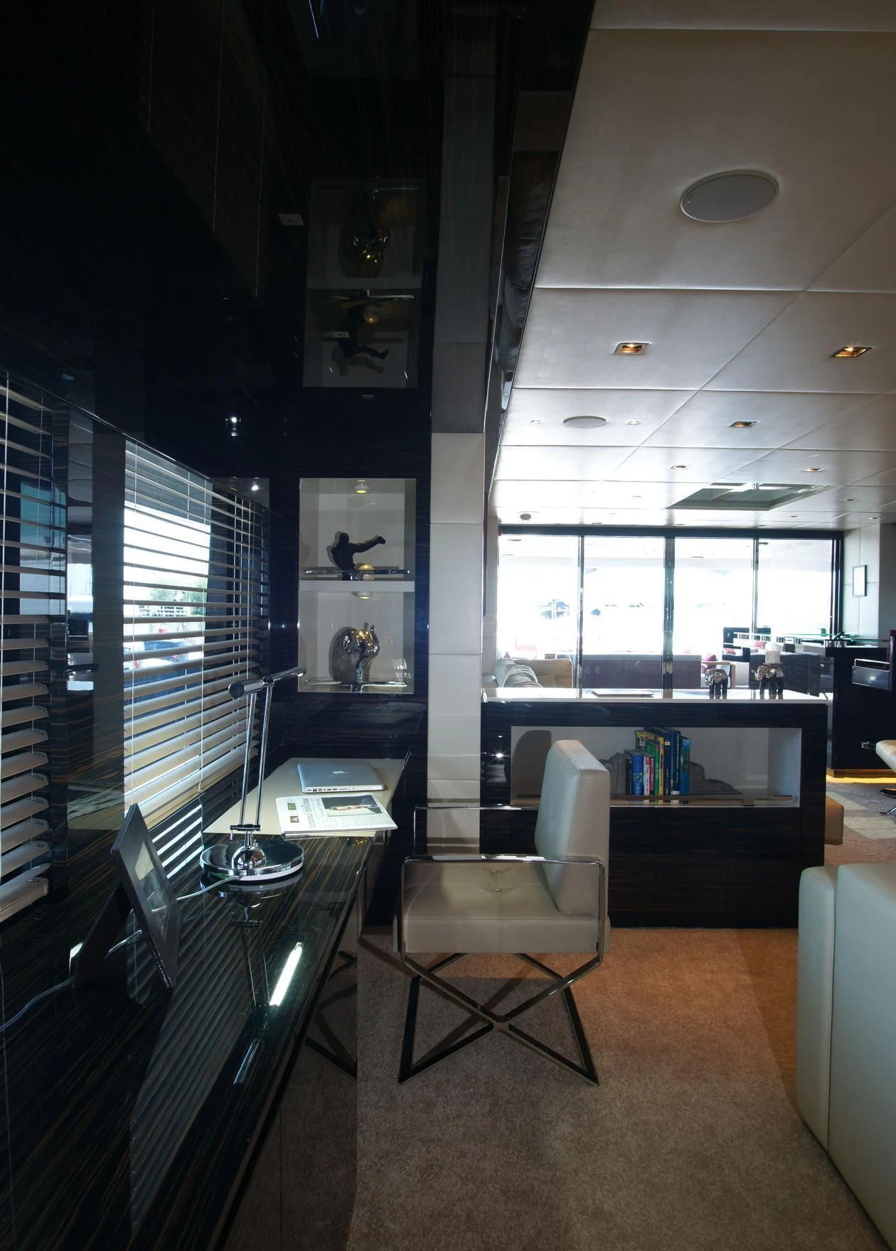 a room with a desk and chairs aboard OCEAN CLUB Yacht for Sale