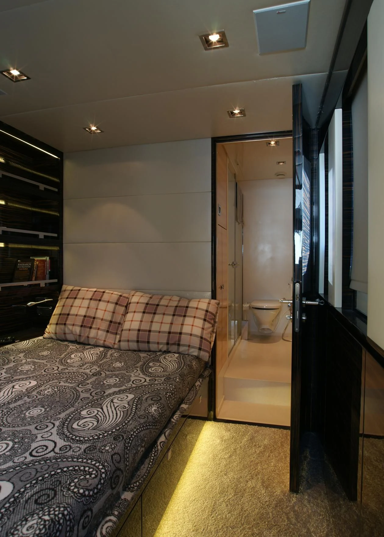 a bed in a room aboard OCEAN CLUB Yacht for Sale