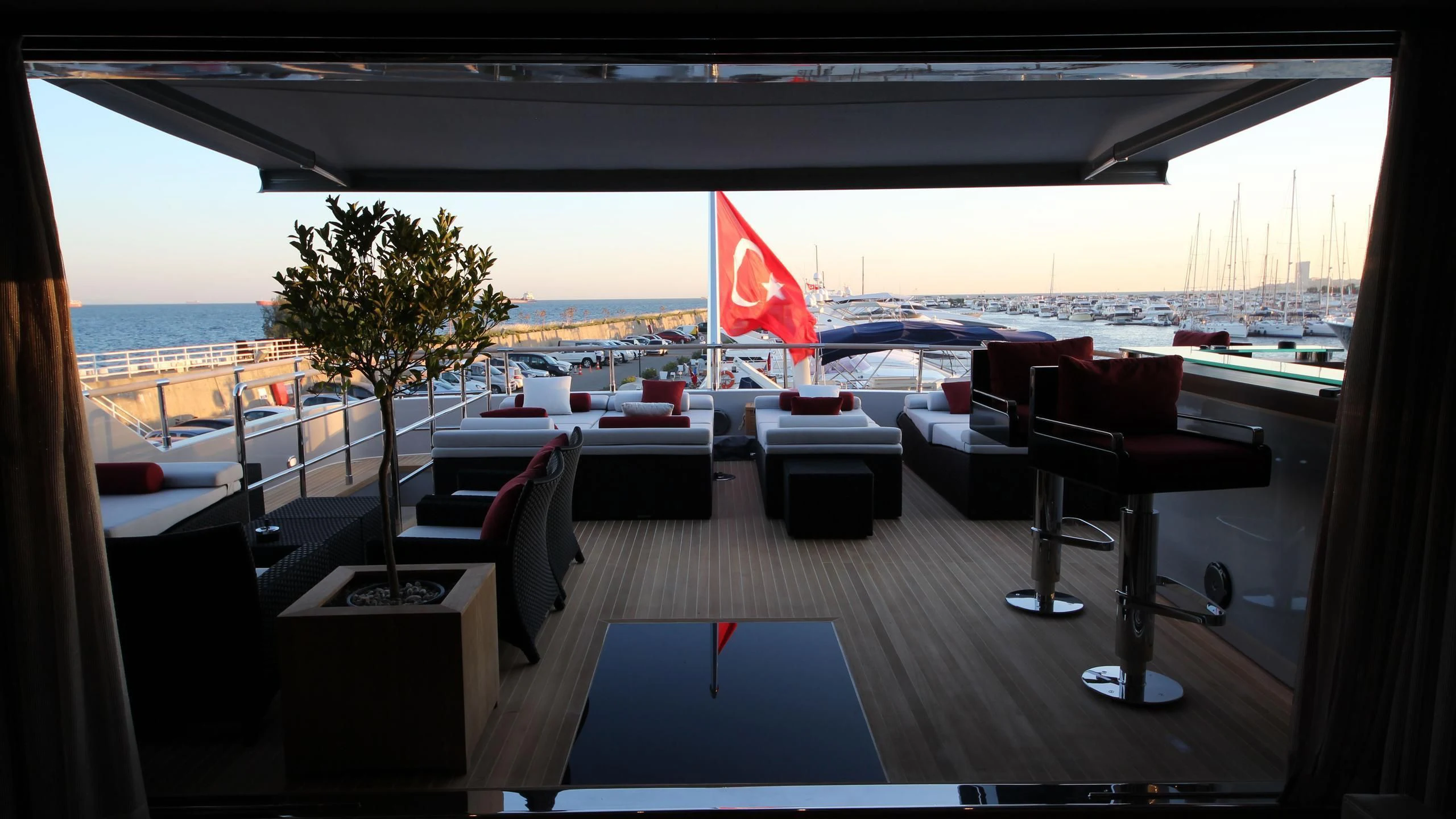 a room with a large window and a view of the ocean aboard OCEAN CLUB Yacht for Sale