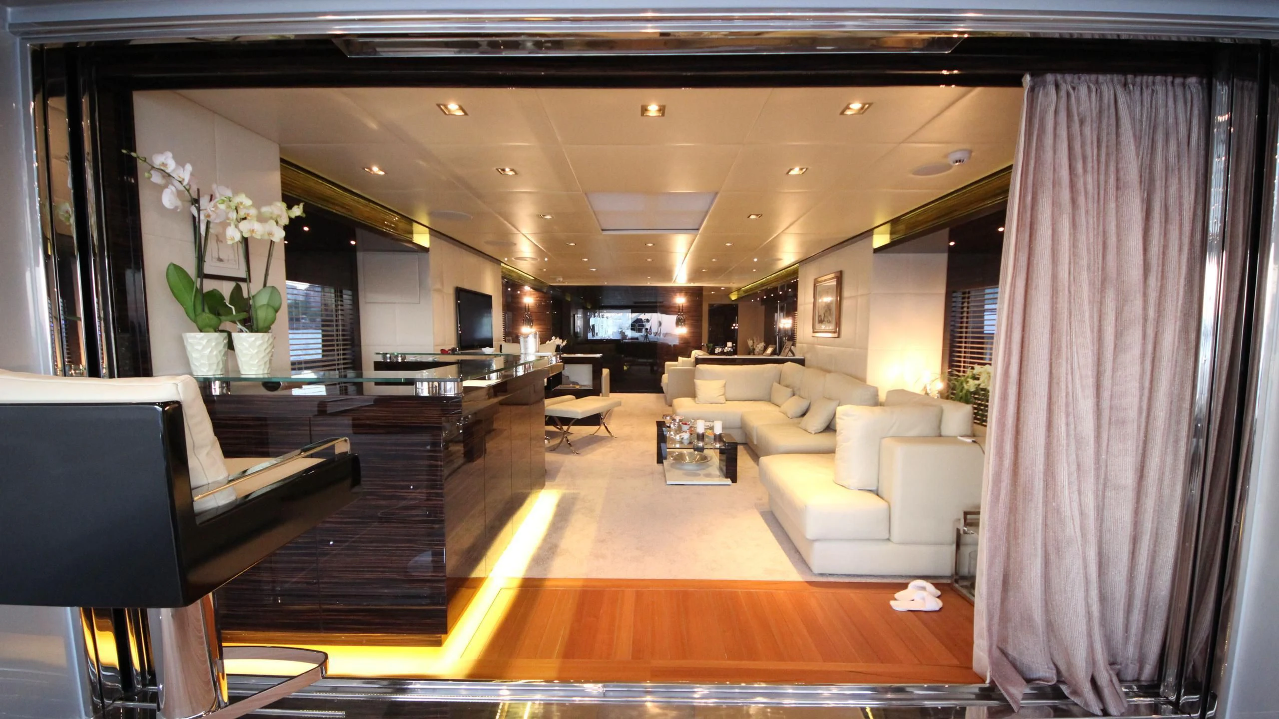 a room with a couch and a table aboard OCEAN CLUB Yacht for Sale