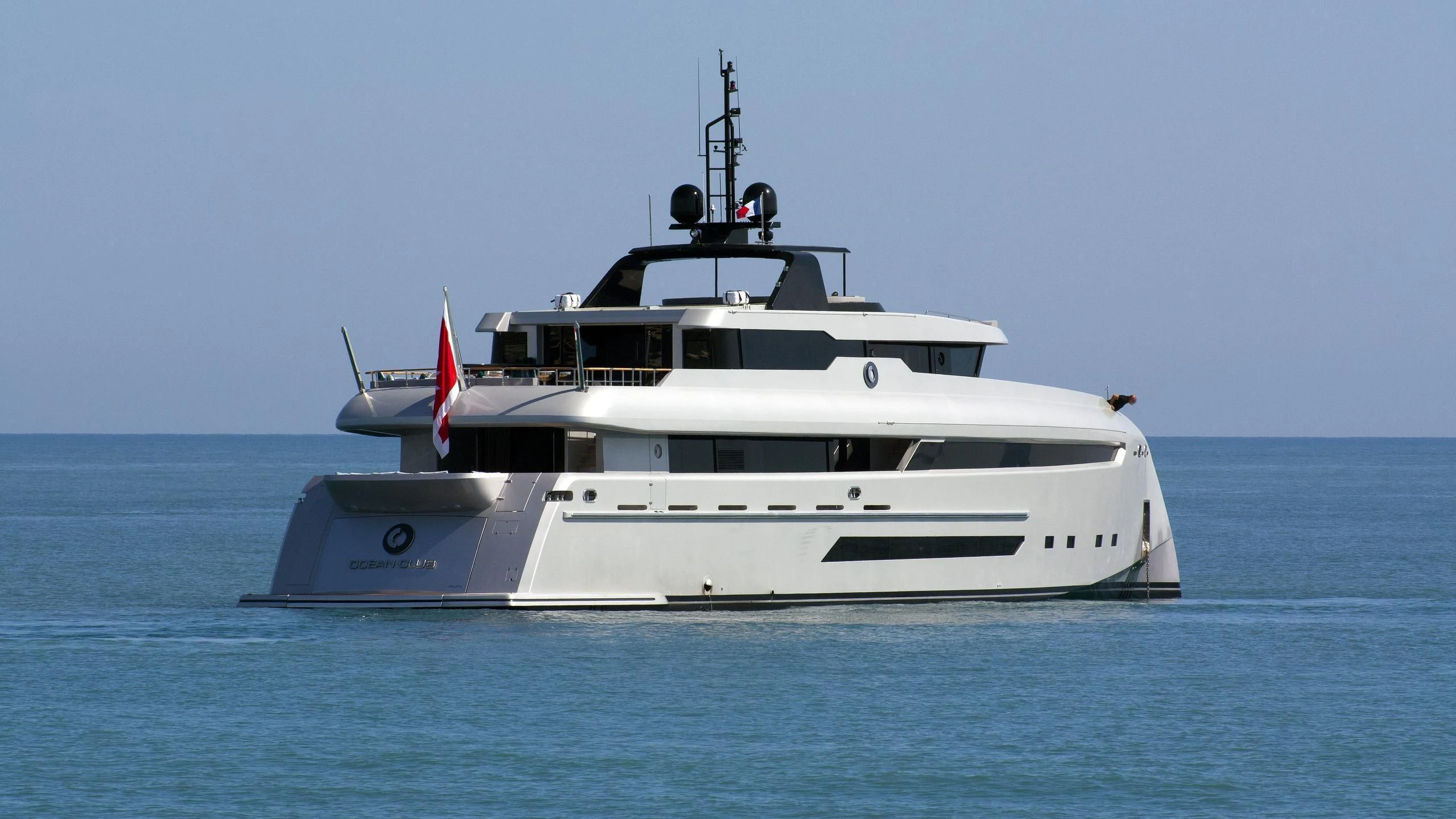 a white yacht in the water aboard OCEAN CLUB Yacht for Sale
