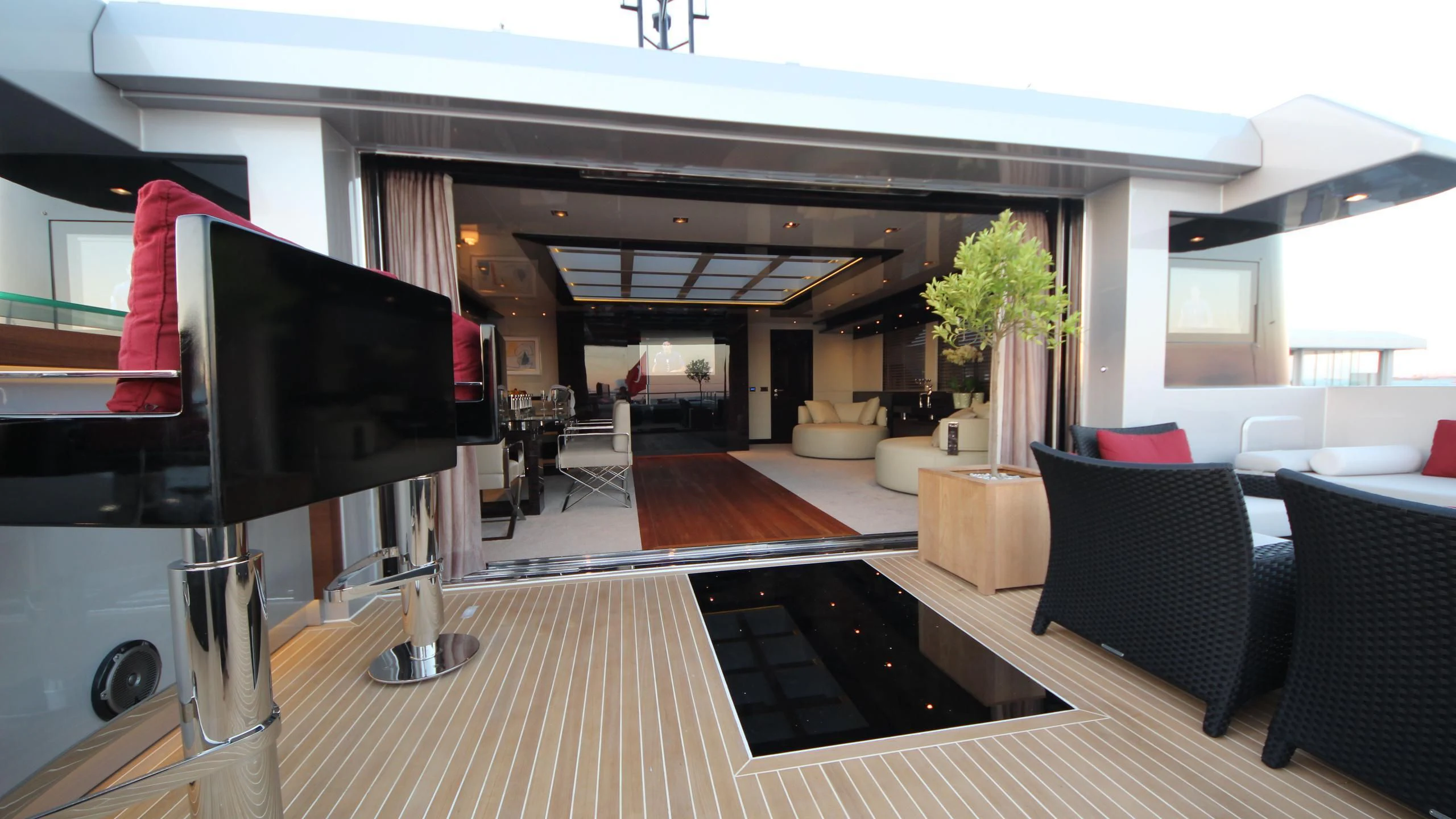 a large room with a large deck and a large tv aboard OCEAN CLUB Yacht for Sale