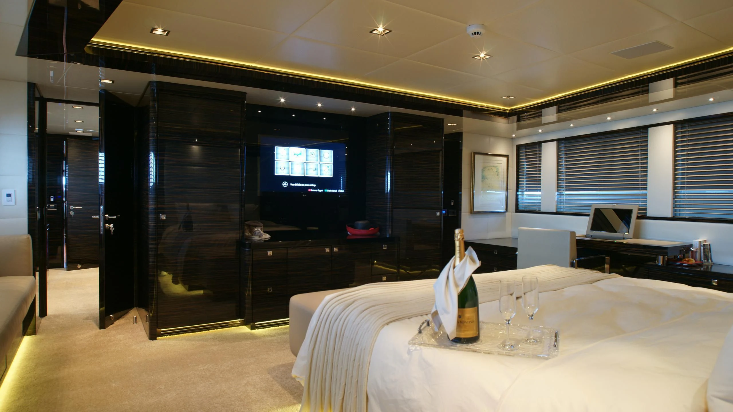 a room with a table and chairs aboard OCEAN CLUB Yacht for Sale