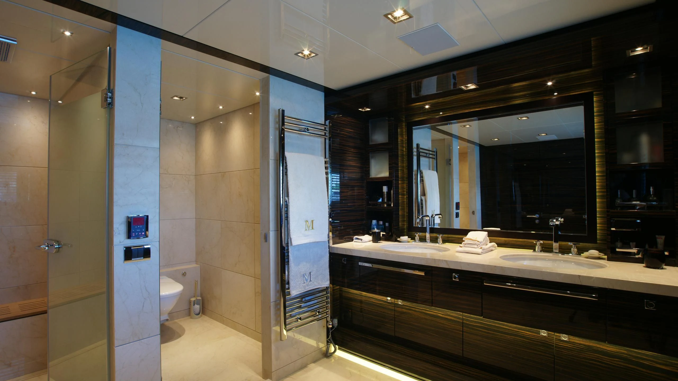 a bathroom with a large mirror aboard OCEAN CLUB Yacht for Sale