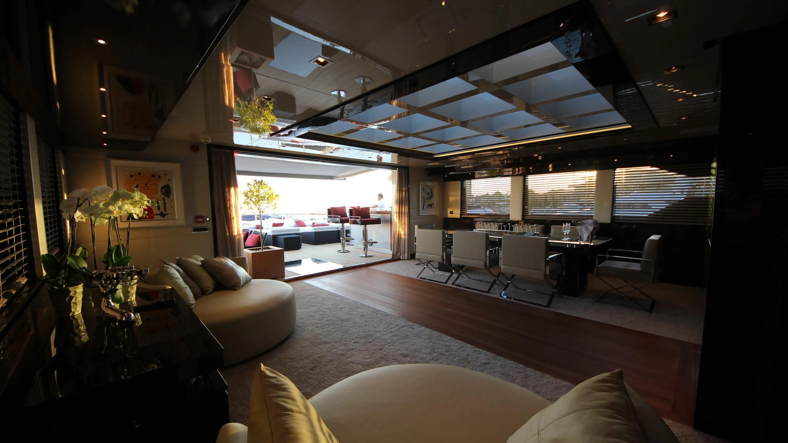a living room with a large window aboard OCEAN CLUB Yacht for Sale