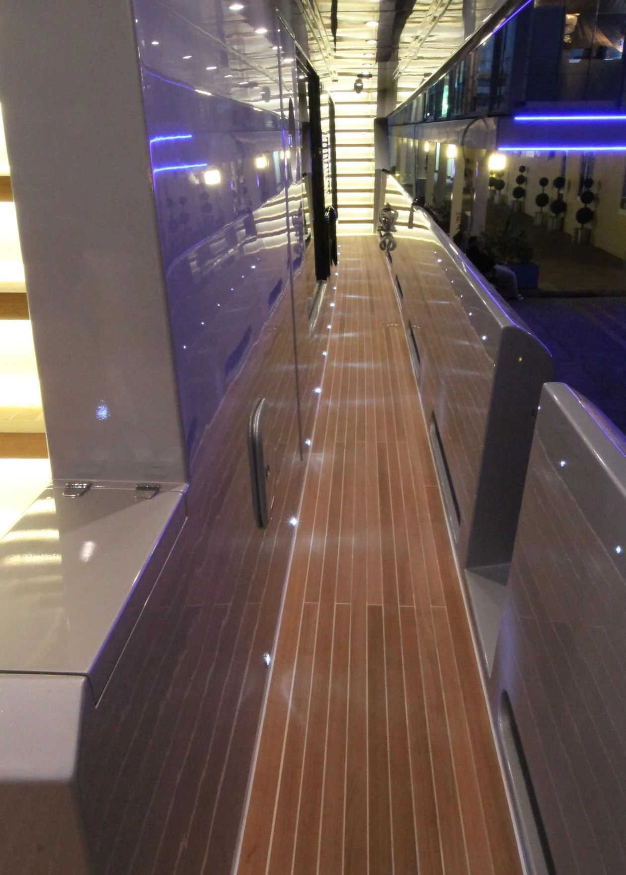 a long hallway with lights aboard OCEAN CLUB Yacht for Sale