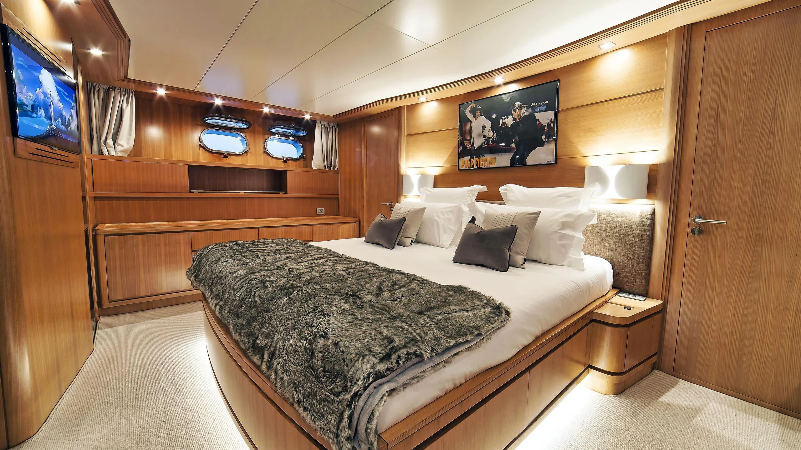 a bed in a room aboard FASTER Yacht for Sale