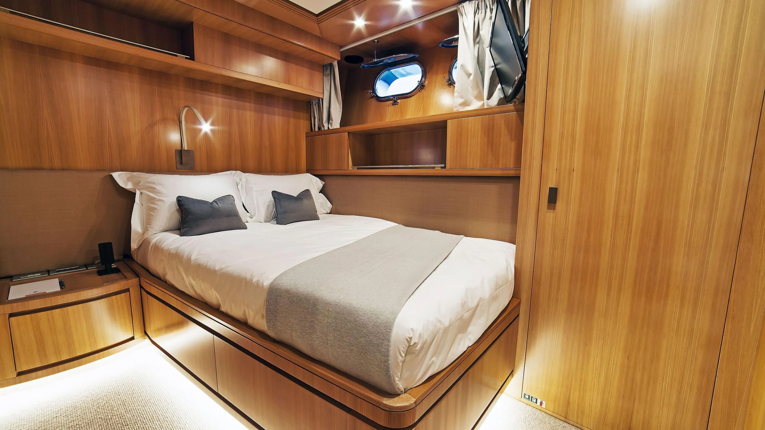 a bed in a room aboard FASTER Yacht for Sale