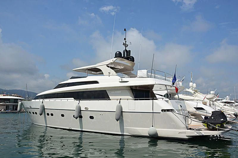 a white yacht in the water aboard FASTER Yacht for Sale