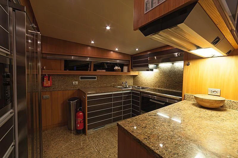 a kitchen with a large countertop aboard FASTER Yacht for Sale