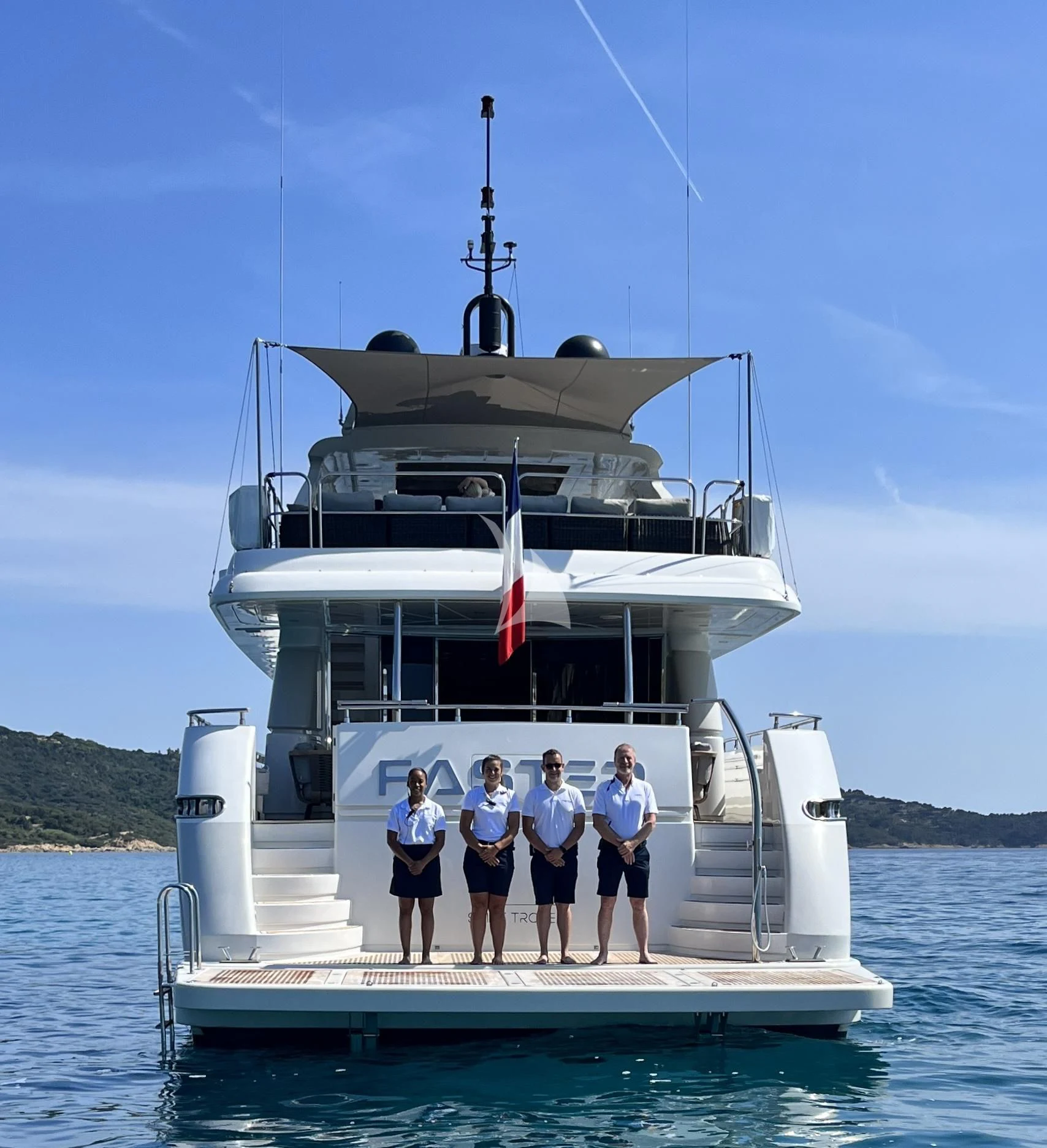 a group of people on a boat aboard FASTER Yacht for Sale