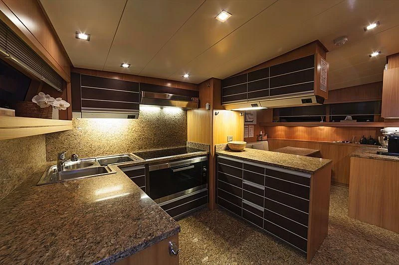 a kitchen with granite counter tops aboard FASTER Yacht for Sale