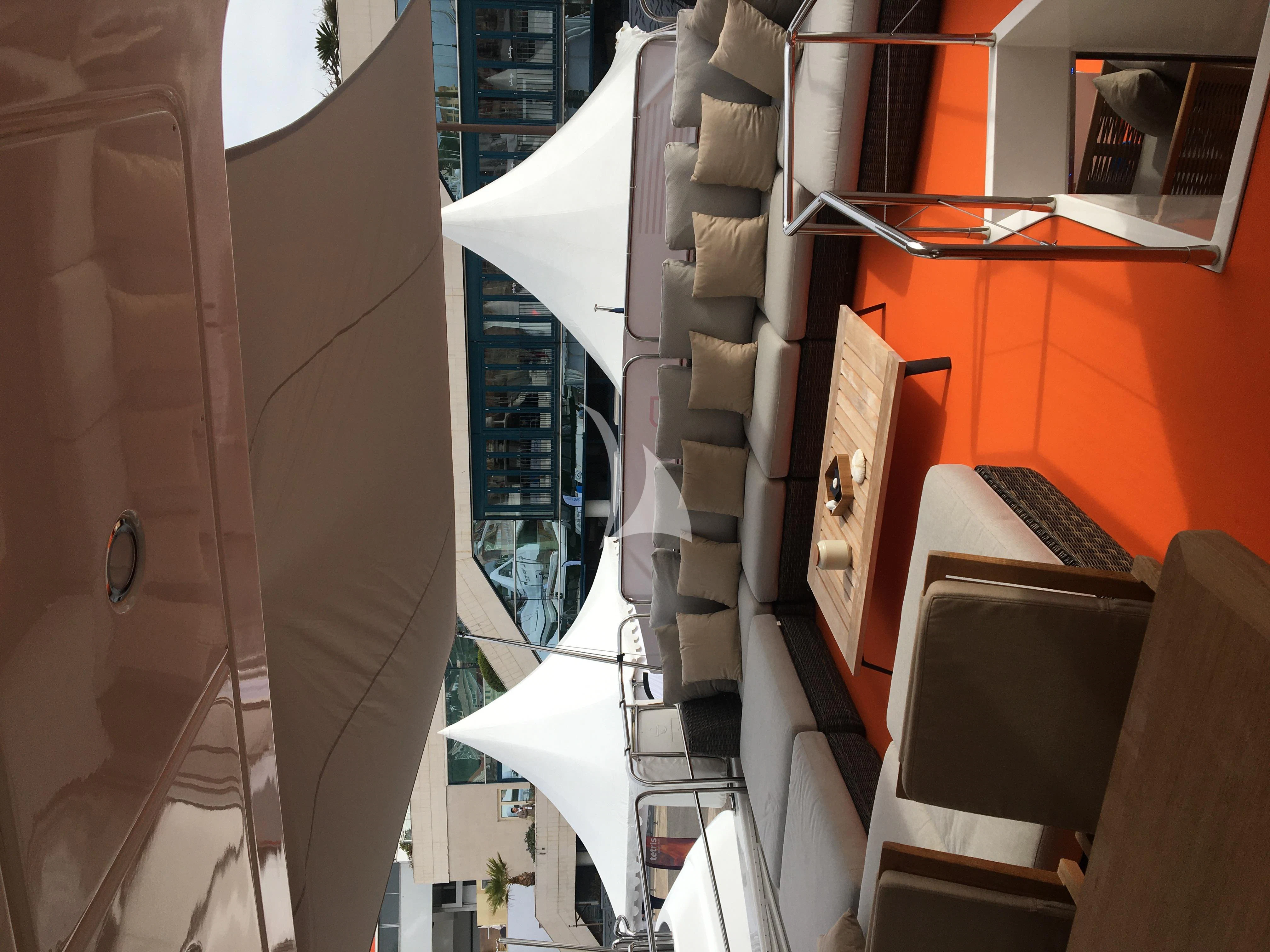 a group of buildings with a sign on the side aboard FASTER Yacht for Sale