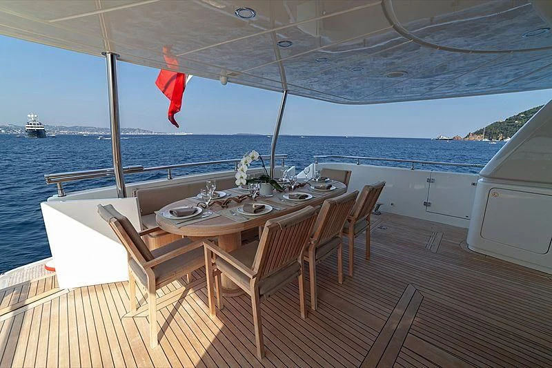 a table on a boat aboard FASTER Yacht for Sale