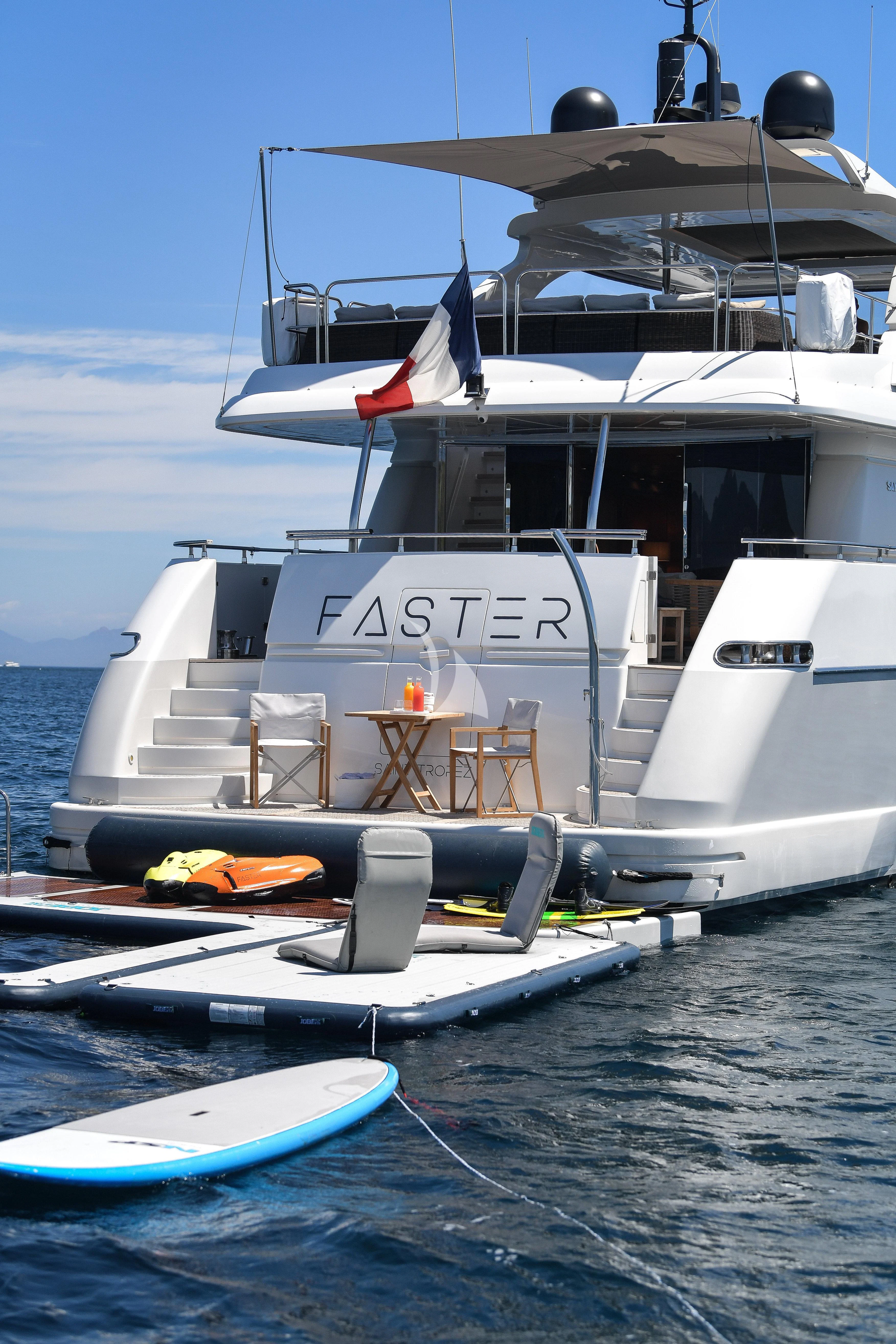 a boat docked at a pier aboard FASTER Yacht for Sale
