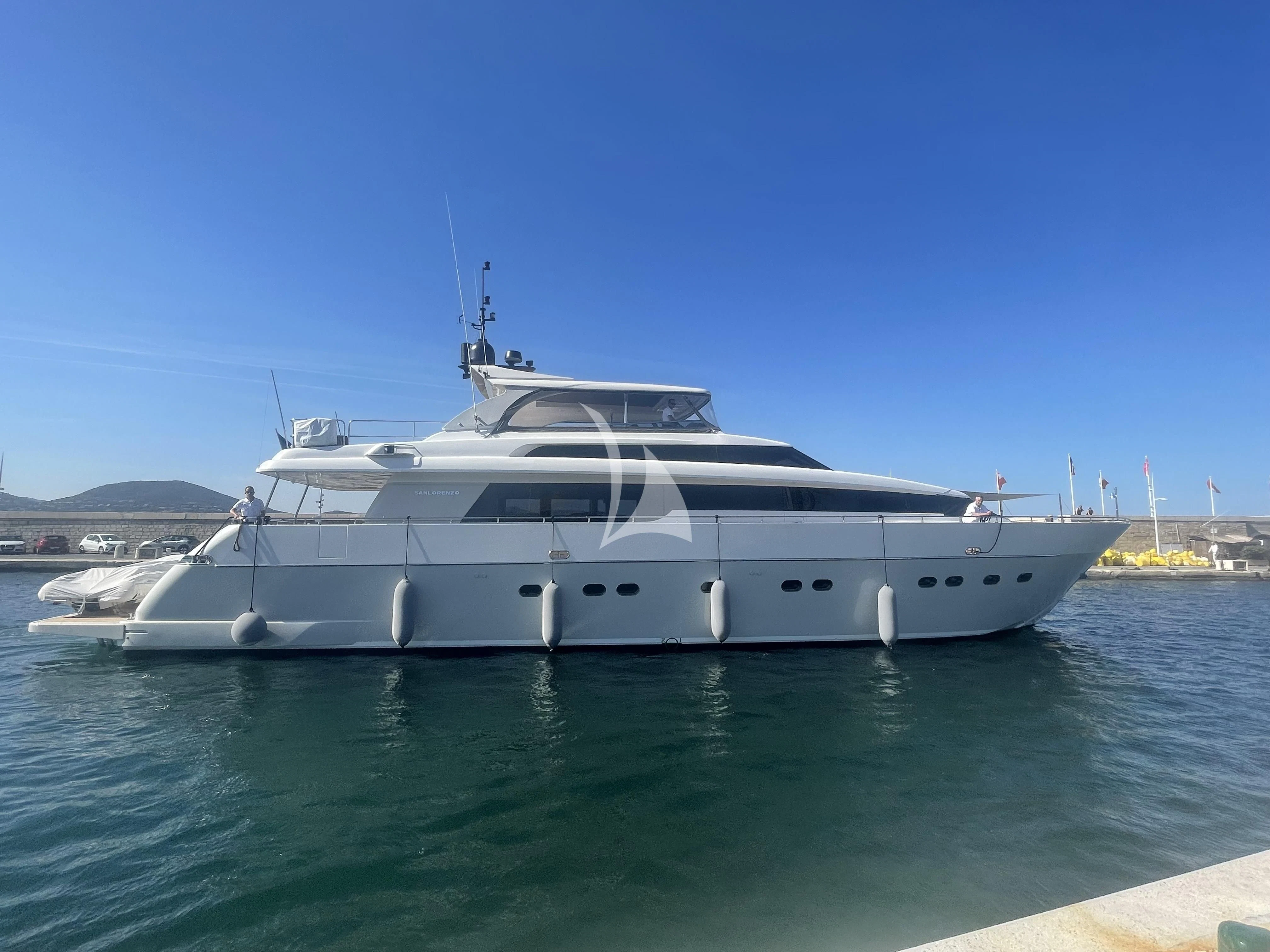a white yacht in the water aboard FASTER Yacht for Sale