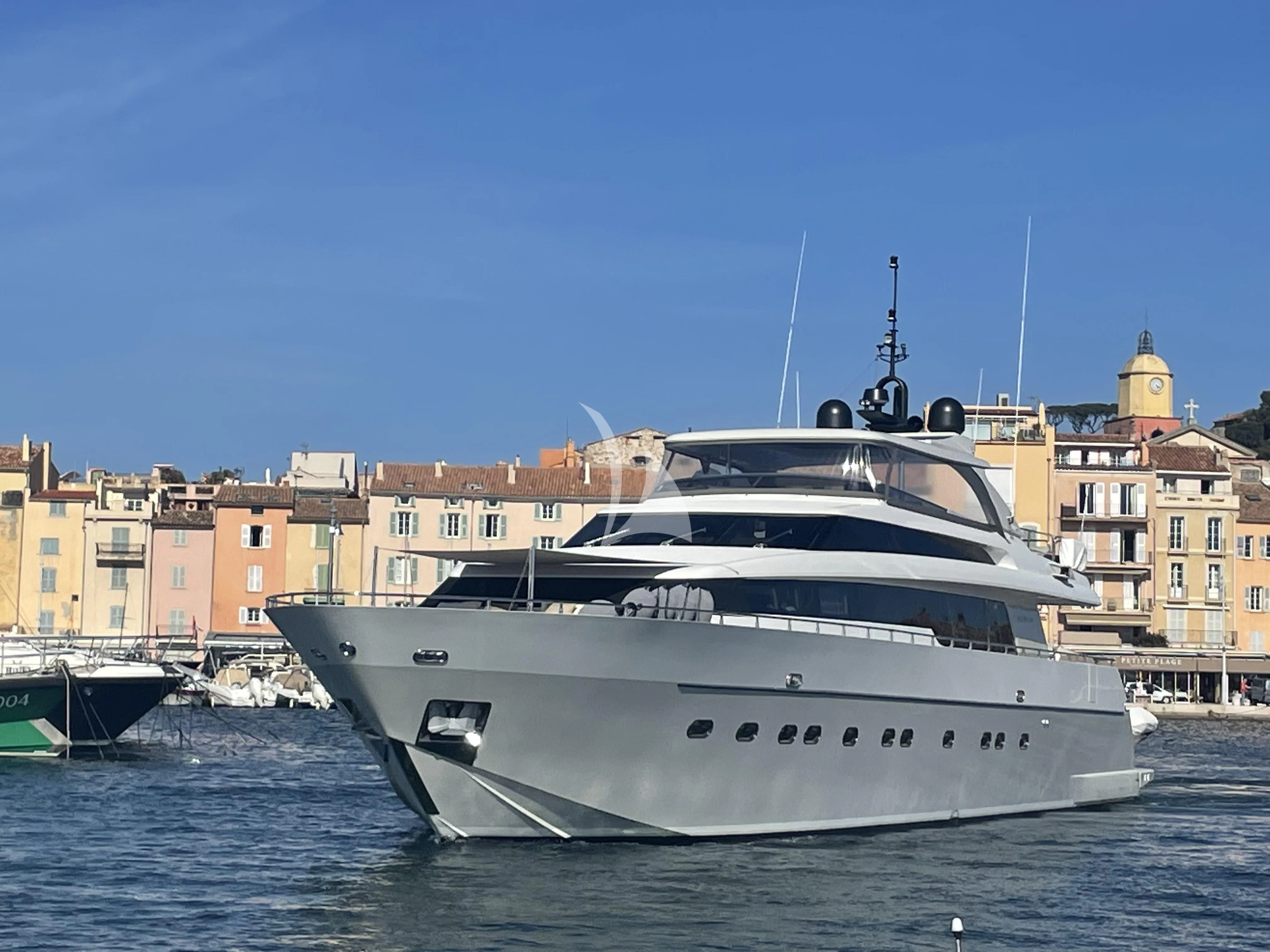 a white yacht in the water aboard FASTER Yacht for Sale