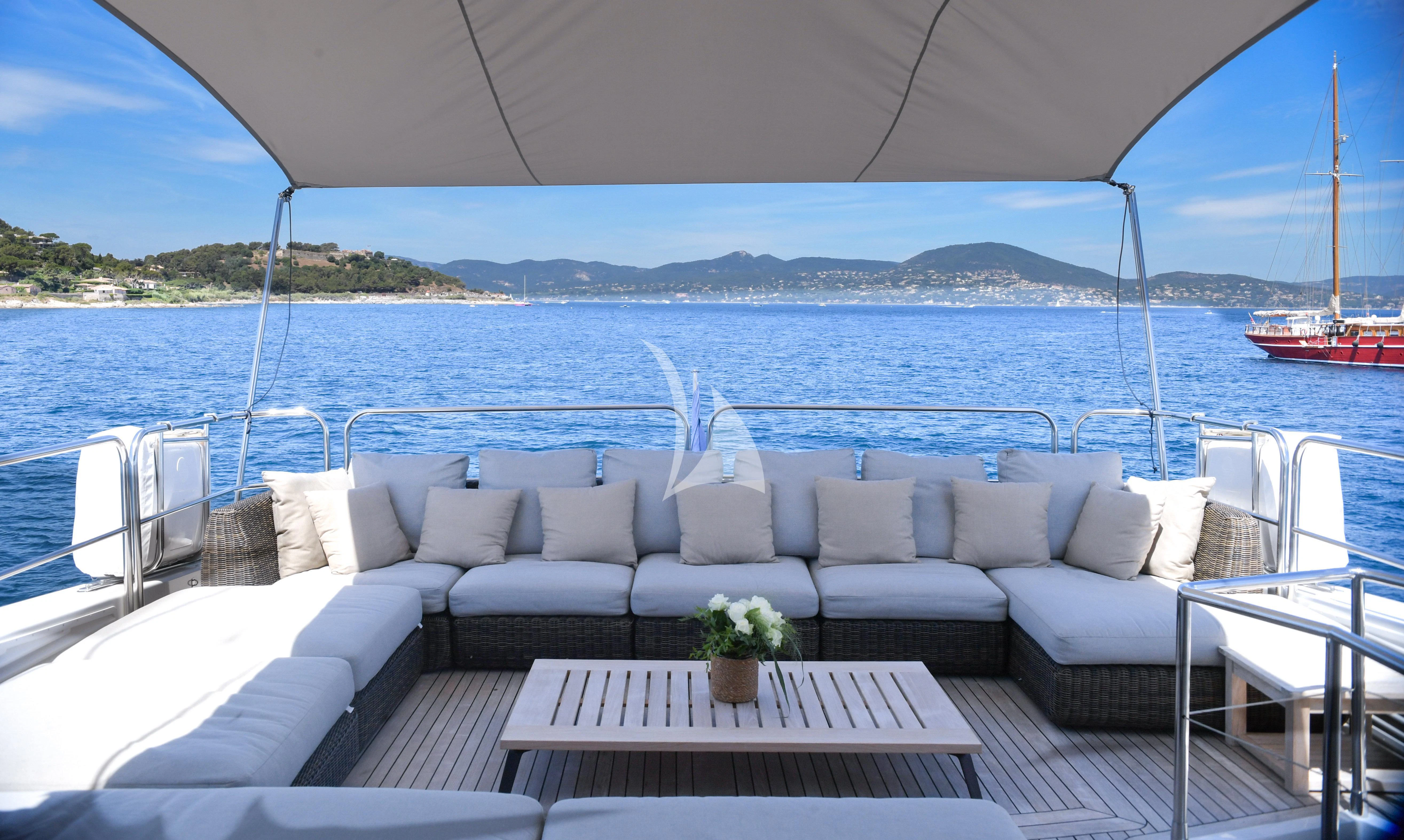 a white couch on a boat aboard FASTER Yacht for Sale
