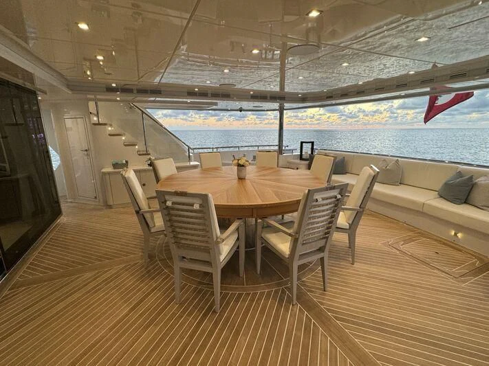 a table and chairs on a deck aboard KING BABY Yacht for Sale