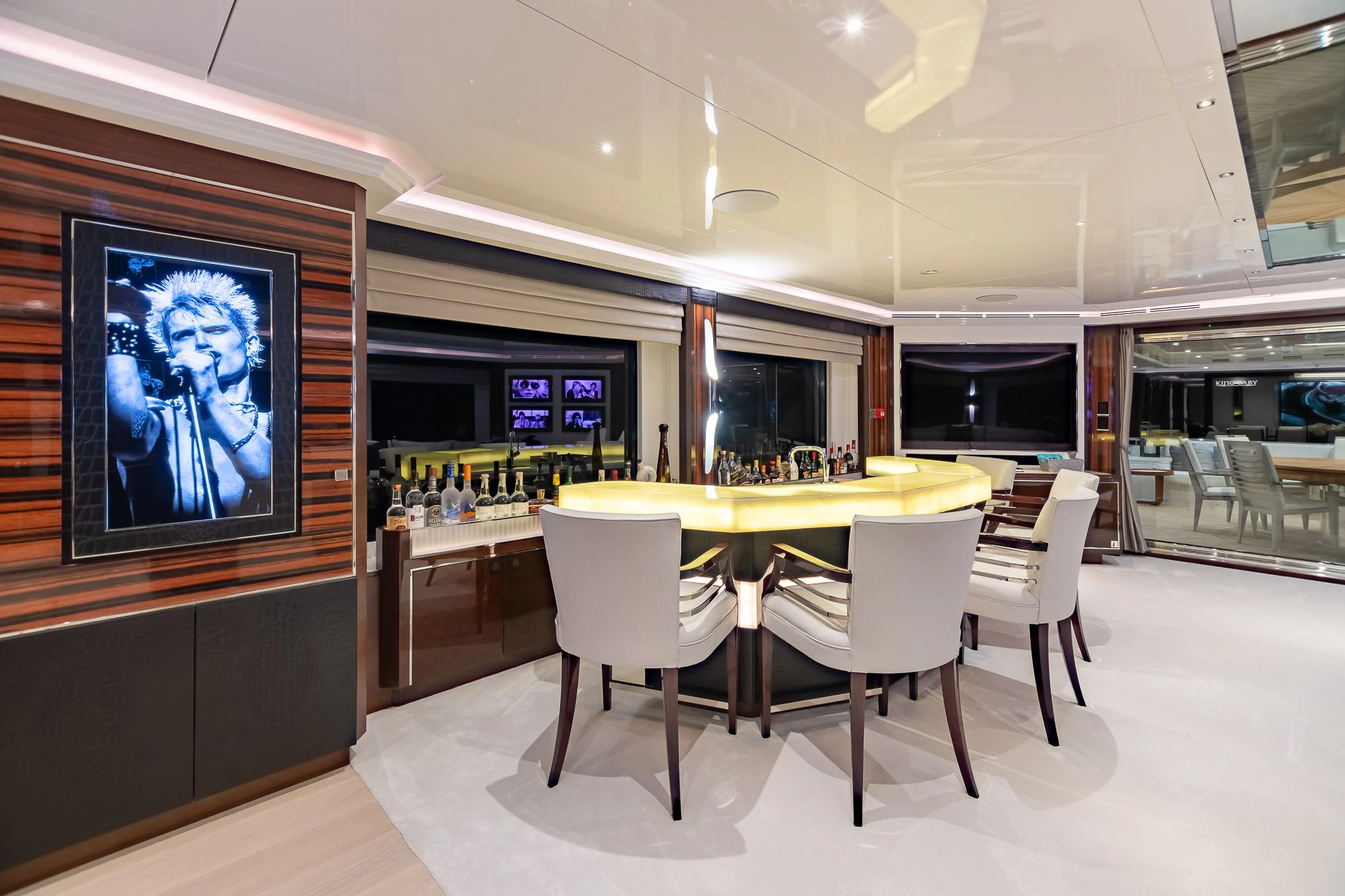 a room with a table and chairs aboard KING BABY Yacht for Sale