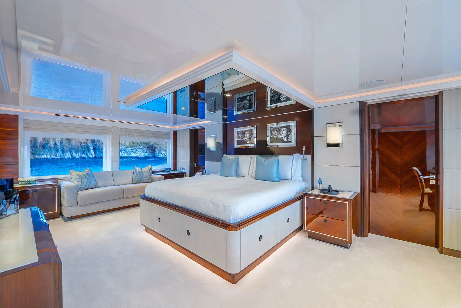 a bedroom with a bed and a couch aboard KING BABY Yacht for Sale