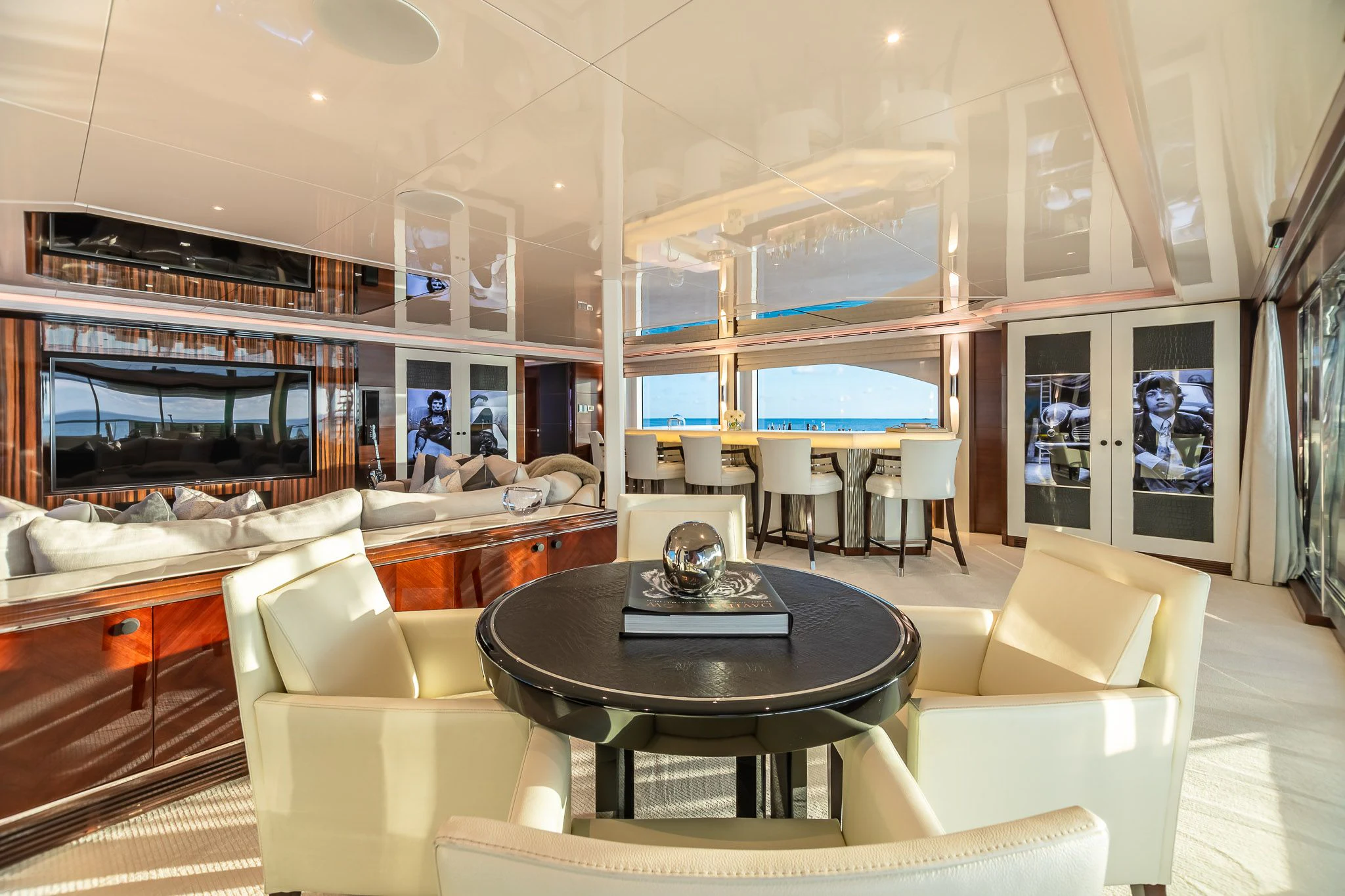 a room with a table and chairs aboard KING BABY Yacht for Sale