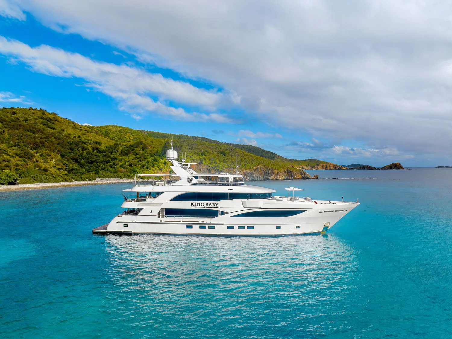a white yacht in the water aboard KING BABY Yacht for Sale