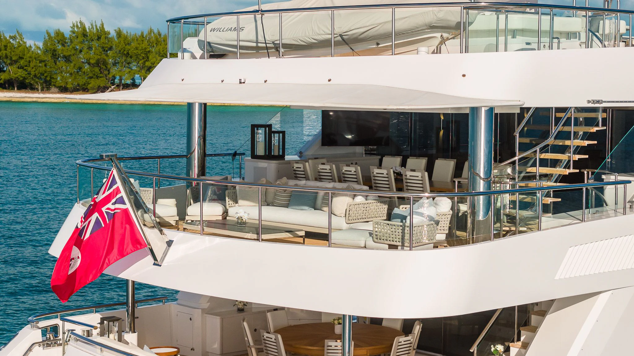 a boat with a flag on the front aboard KING BABY Yacht for Sale