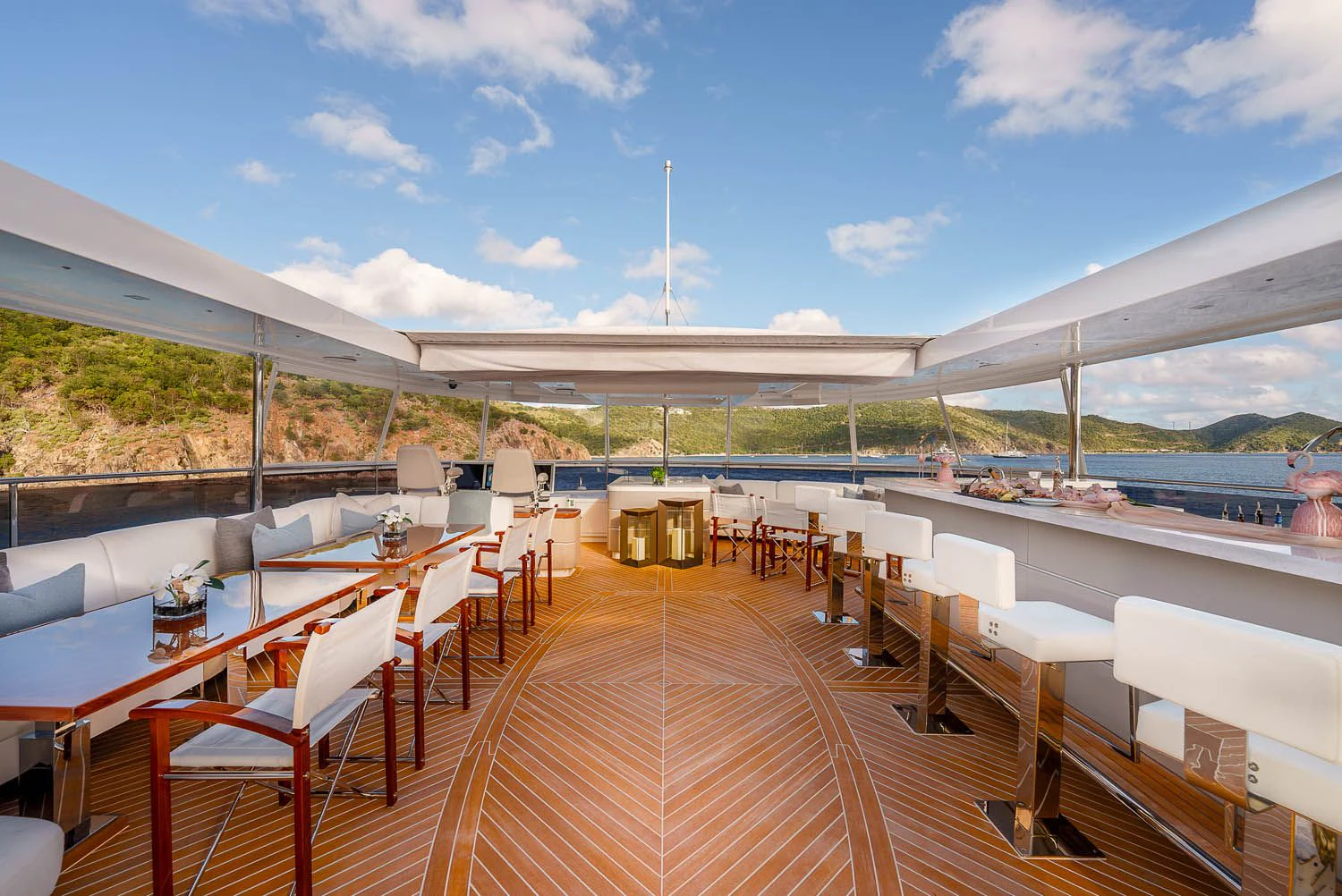 a deck with a deck and chairs aboard KING BABY Yacht for Sale