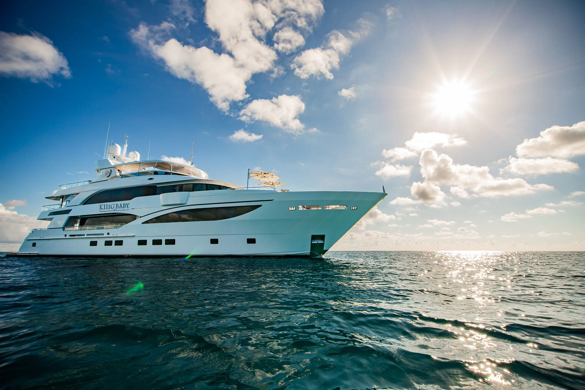 a white yacht on the water aboard KING BABY Yacht for Sale