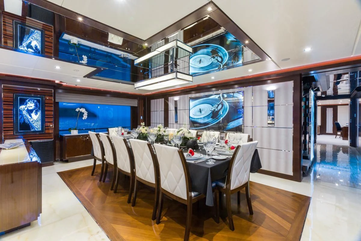 a room with a table and chairs aboard KING BABY Yacht for Sale