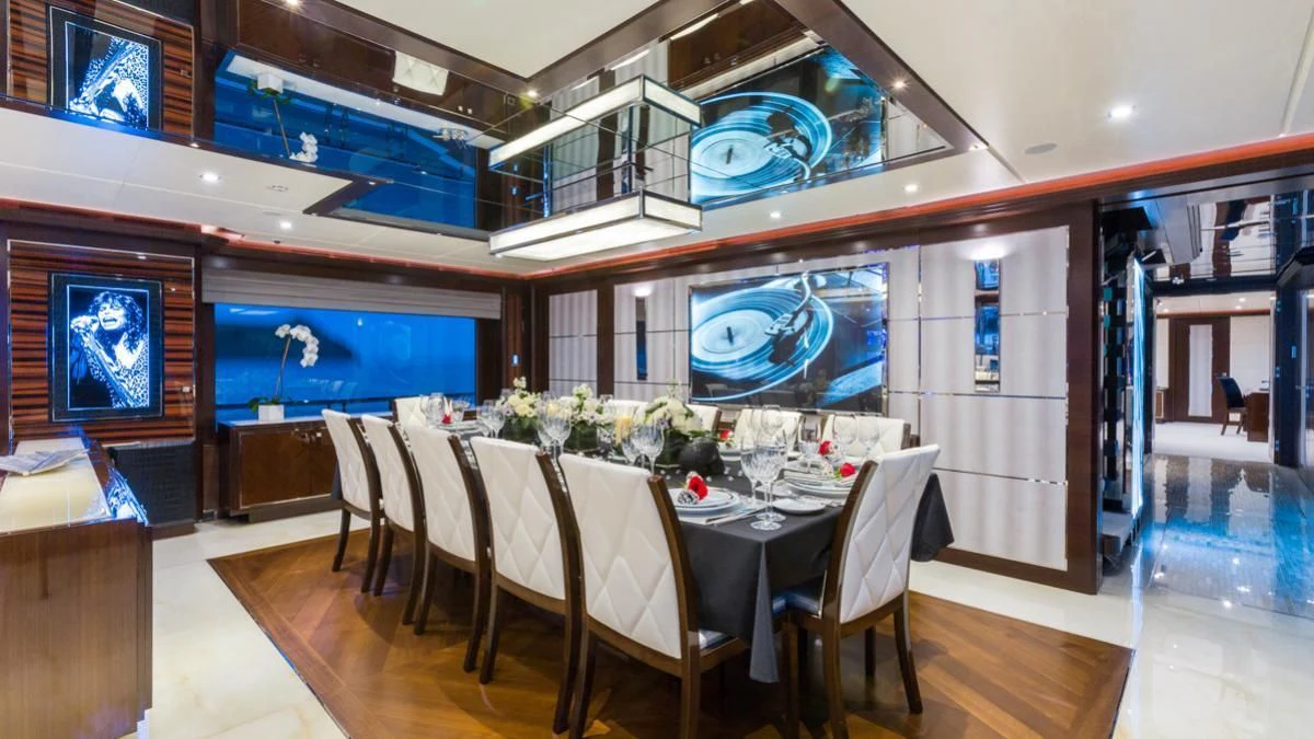 a dining room with a table and chairs aboard KING BABY Yacht for Sale