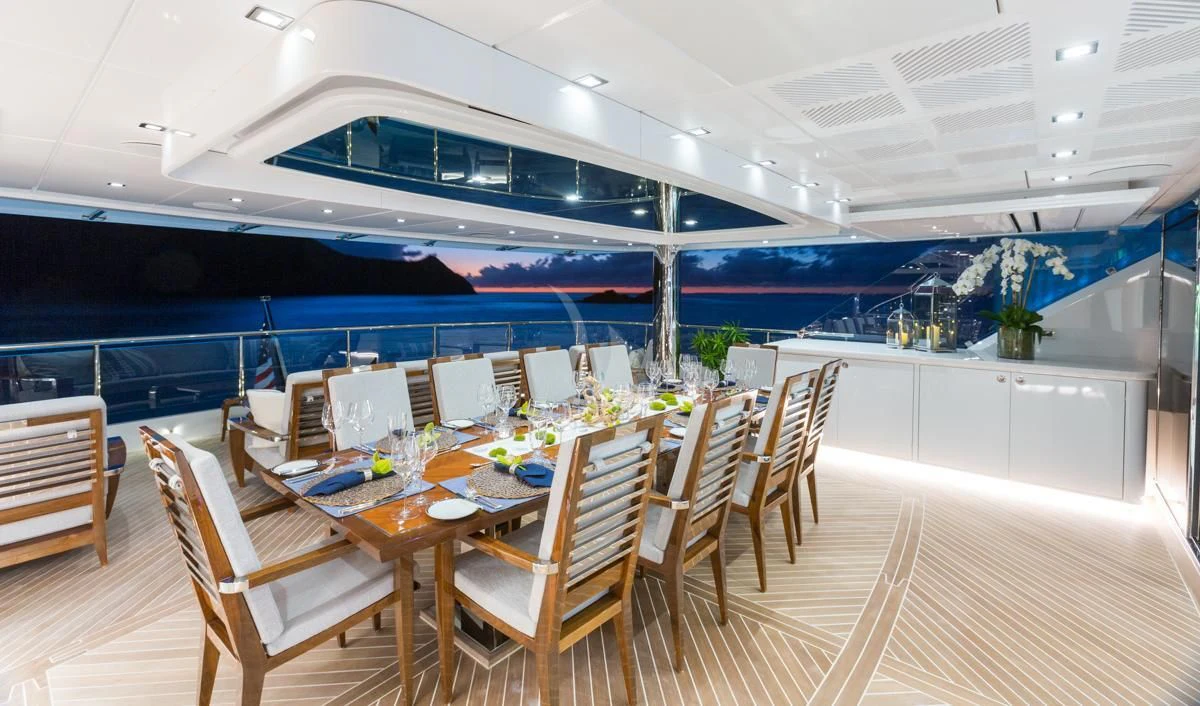 a dining room with a table and chairs aboard KING BABY Yacht for Sale
