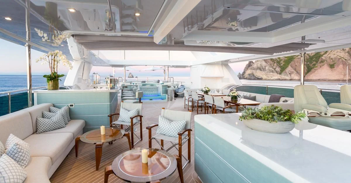 a room with a table and chairs aboard KING BABY Yacht for Sale