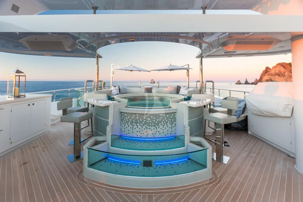 a large white room with a pool table and chairs aboard KING BABY Yacht for Sale