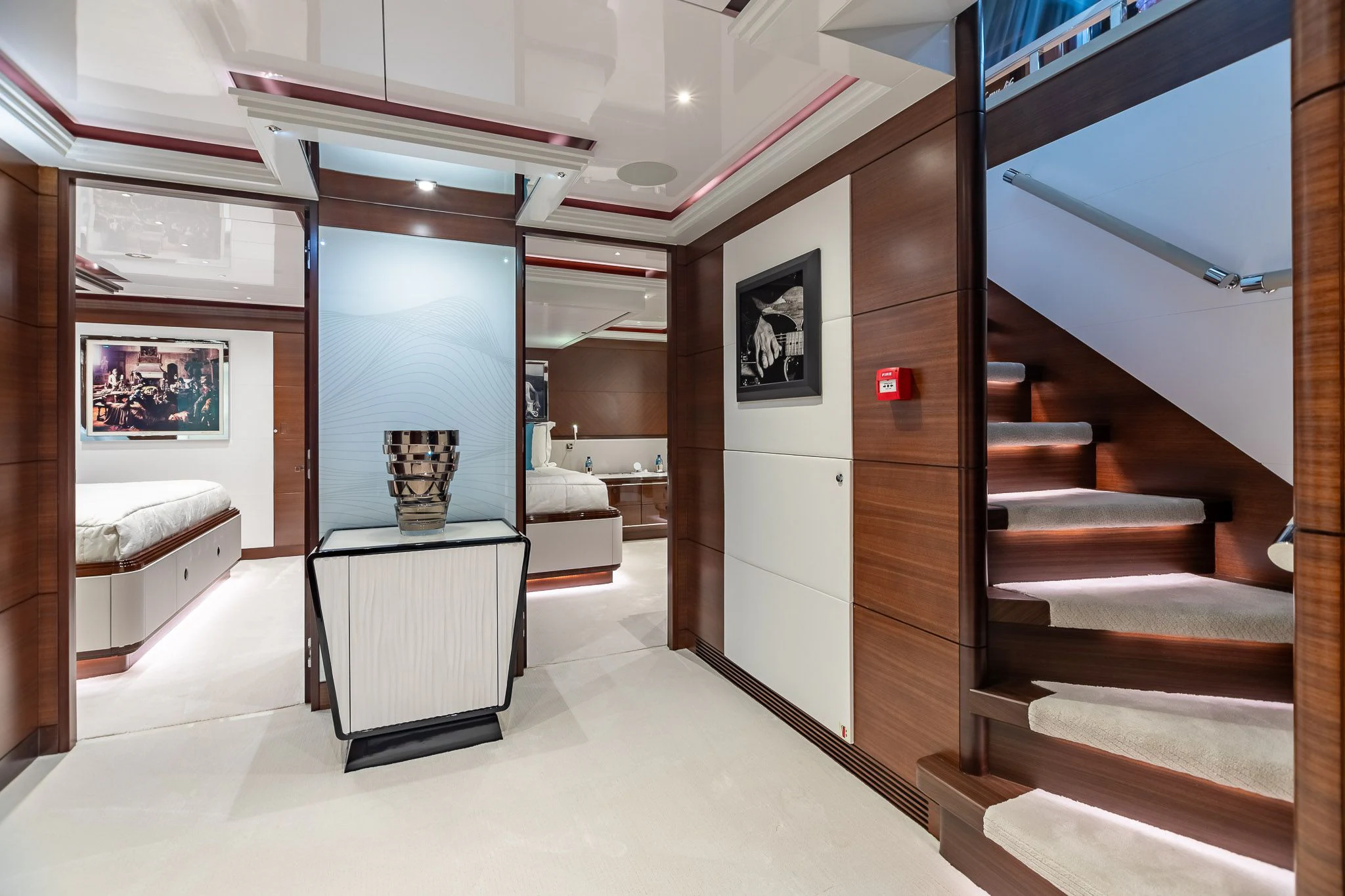 a room with a staircase and a table aboard KING BABY Yacht for Sale