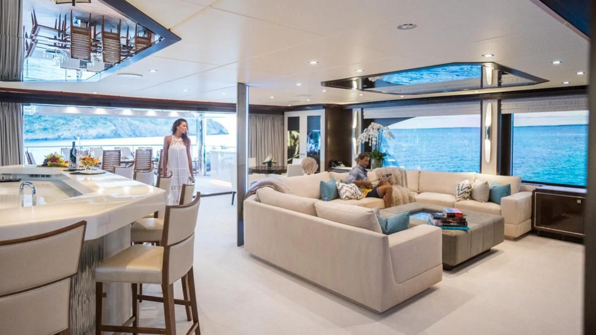 a couple of people in a living room aboard KING BABY Yacht for Sale
