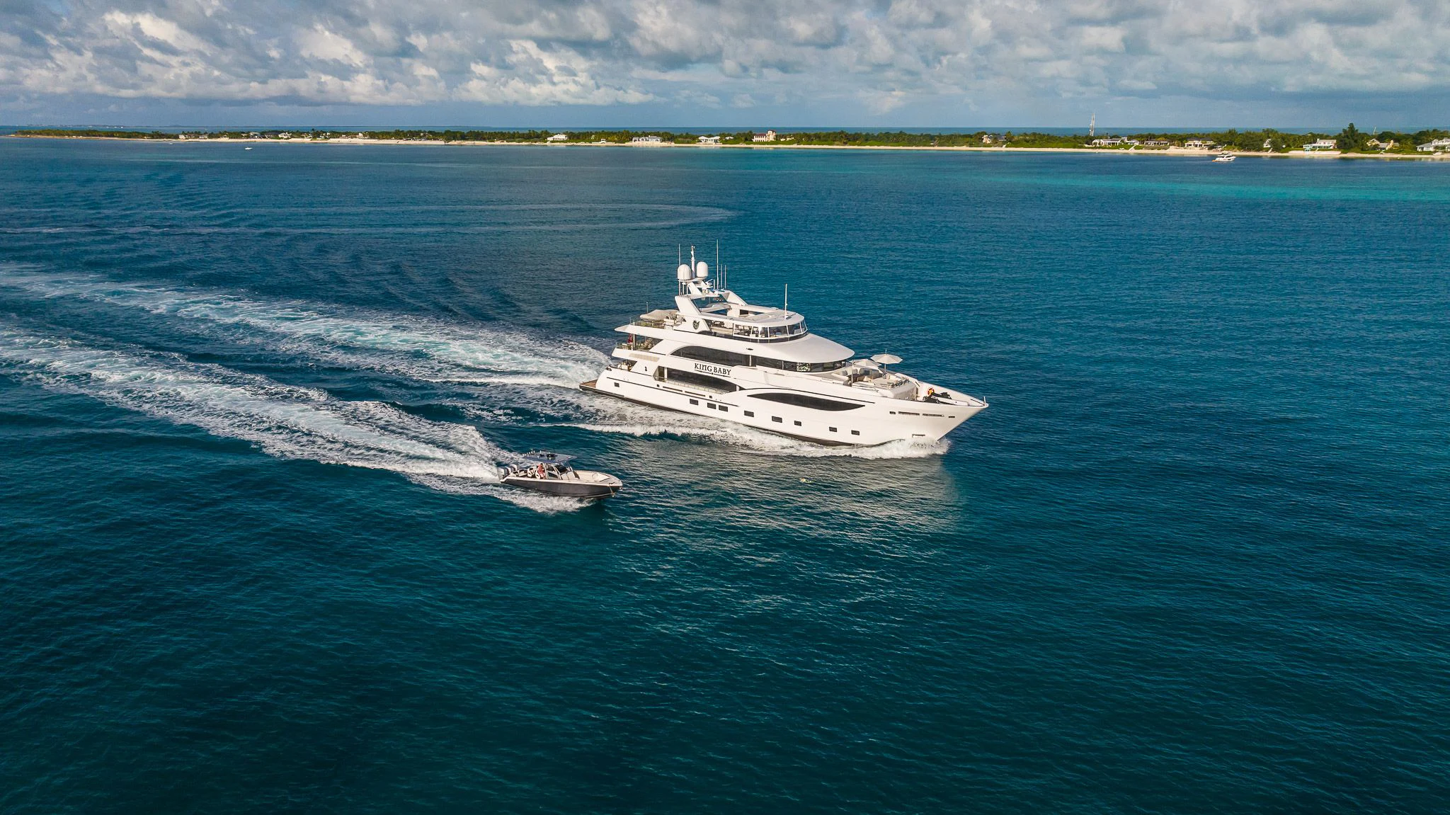 a couple of boats on the water aboard KING BABY Yacht for Sale