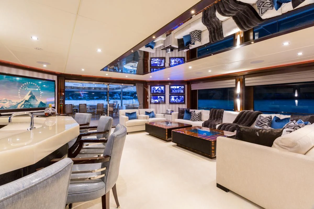 a room with couches and a tv aboard KING BABY Yacht for Sale