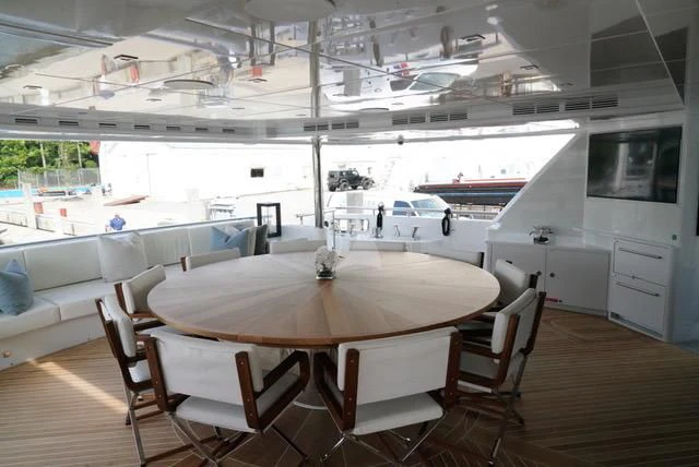 a table with chairs around it aboard KING BABY Yacht for Sale