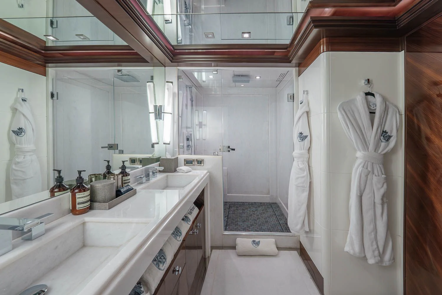 a bathroom with a robe on the wall aboard KING BABY Yacht for Sale