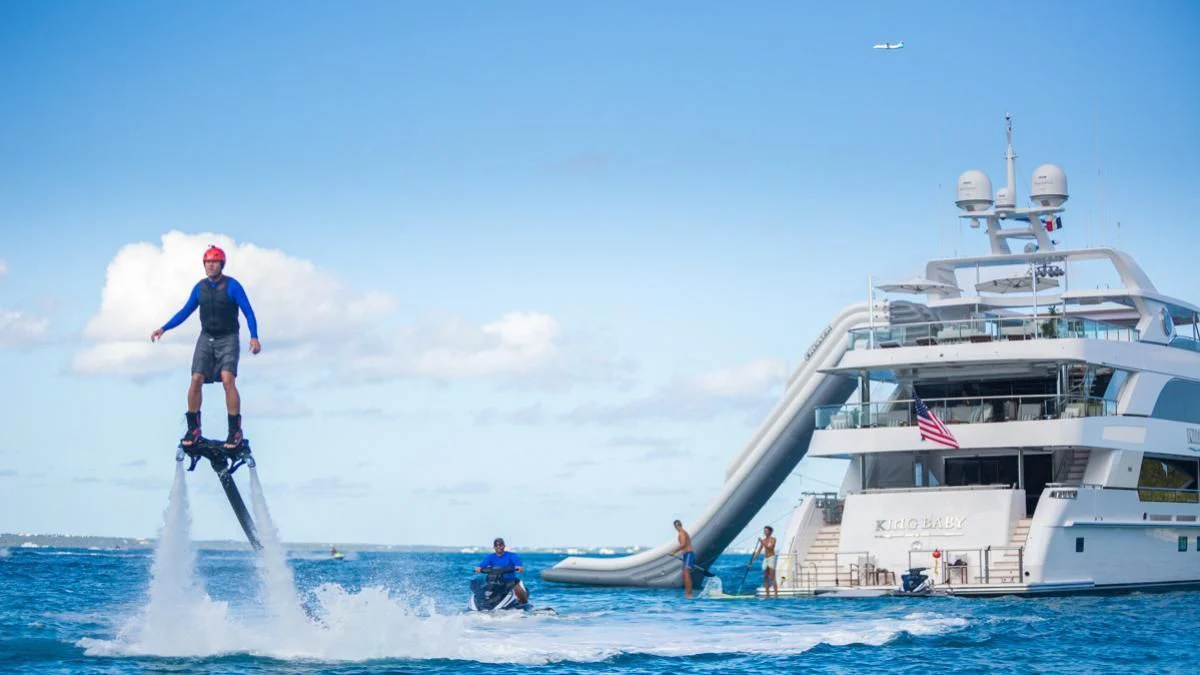 a person jumping into the water aboard KING BABY Yacht for Sale