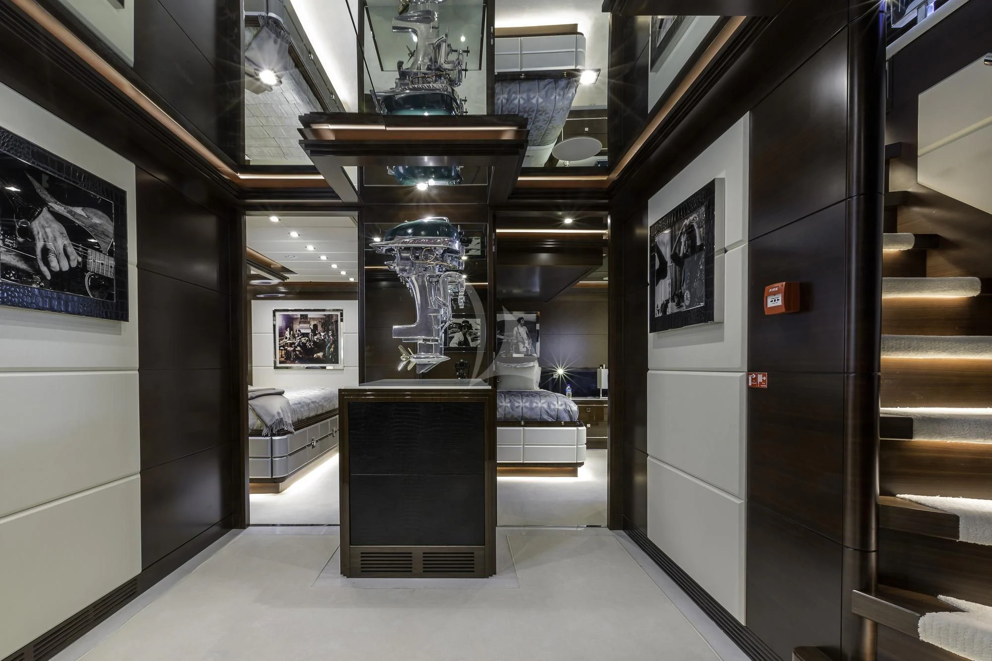 a room with a black table and a black cabinet with pictures on it aboard KING BABY Yacht for Sale